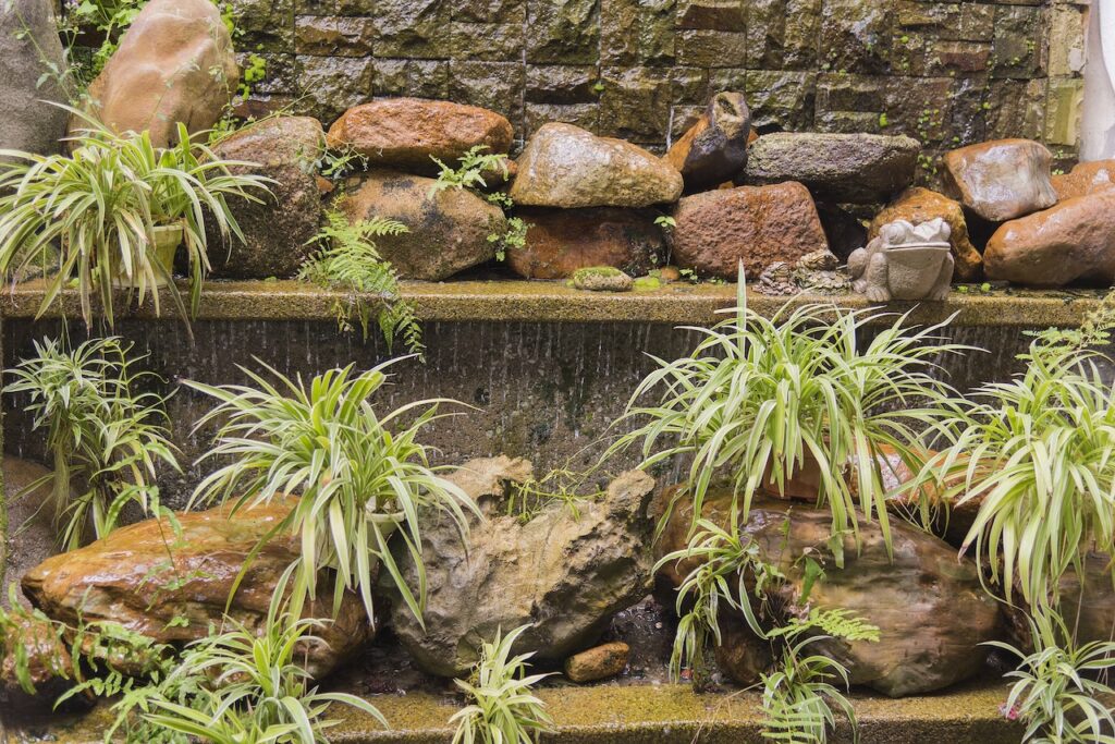 What To Do With a Sloped Backyard Using Water Features